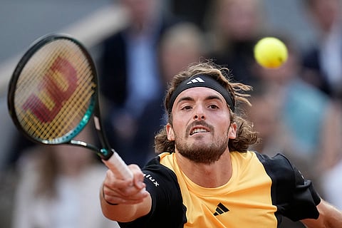 Stefanos Tsitsipas plays a shot against Spain's Carlos Alcaraz